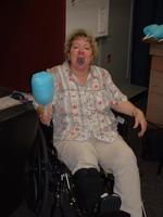 Mom enjoys the cotton candy, even with a broken foot.