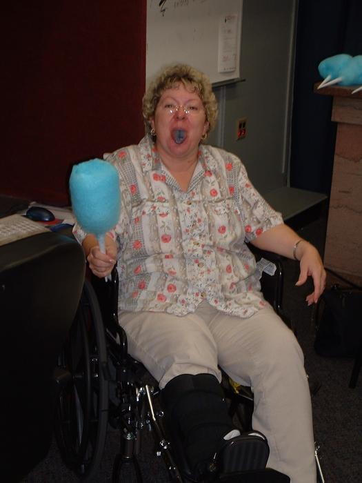 Mom enjoys the cotton candy, even with a broken foot.