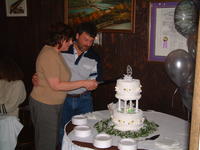 CJ & Sally cutting the cake