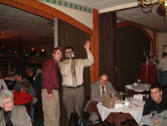 Chad and Brian film Mike taking their photo