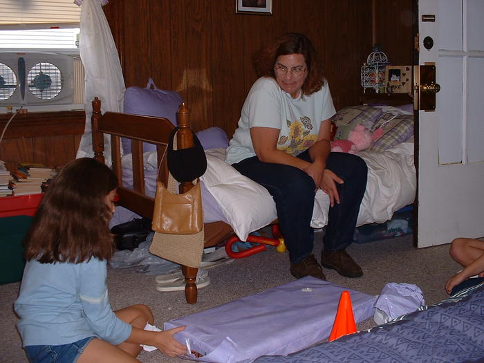 Mom watches as Ashlyn opens her present