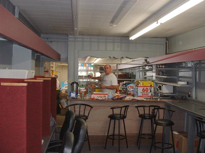 7-12-02, Dad stocking the shelves