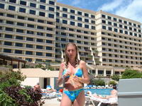 Heather, with our hotel in the background