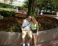 Michael & Heather by flowers in Epcot