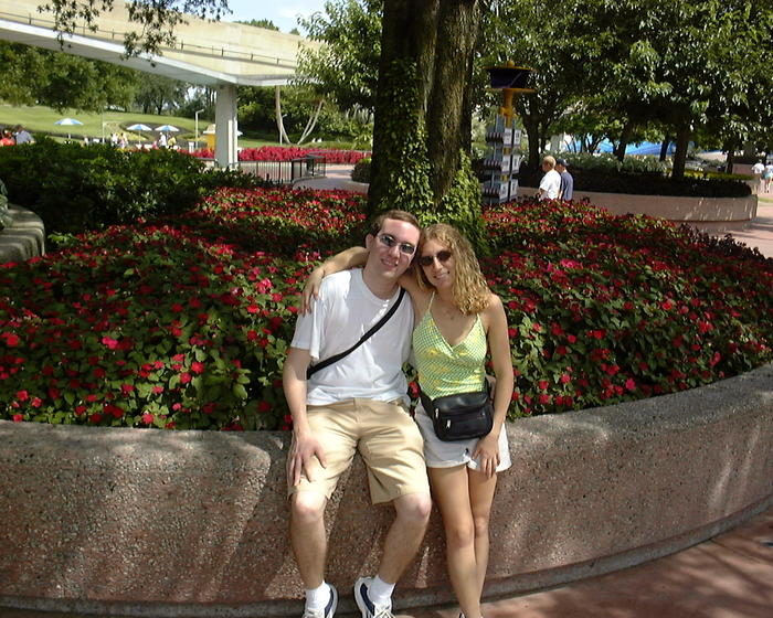 Michael & Heather by flowers in Epcot