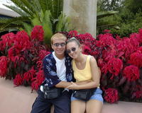 Glenn & Christina by flowers in Epcot
