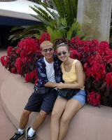 Glenn & Christina by flowers in Epcot