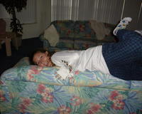Heather jumps over the couch