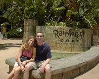 Mike & Heather next to Rainforest Cafe sign