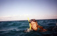 Heather snorkeling near the coral reef