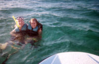 Next to our motor boat in Cancun