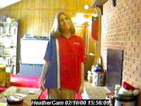 Heather getting ready for work, 2/18/2000