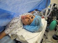 Mommy during the C-section (with thermometer on her head)