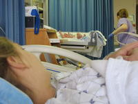 Cameron under the heater as Mommy watches eagerly