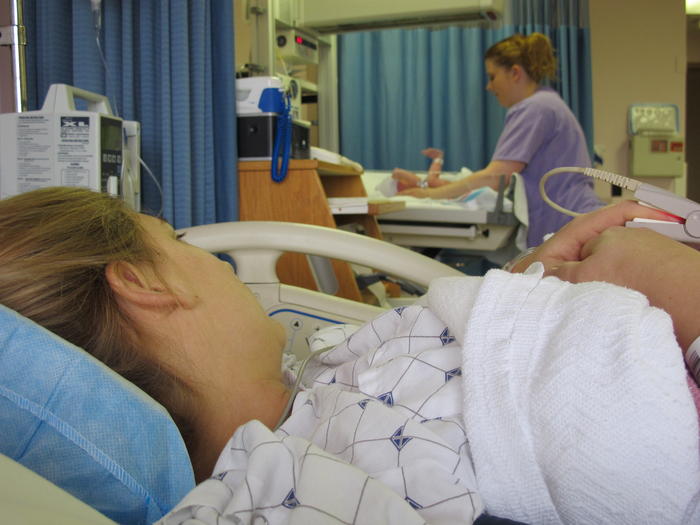 The nurse brings Cameron to Mommy