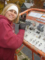 Heather running the boom lift.