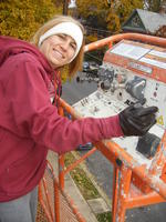 Heather running the boom lift.