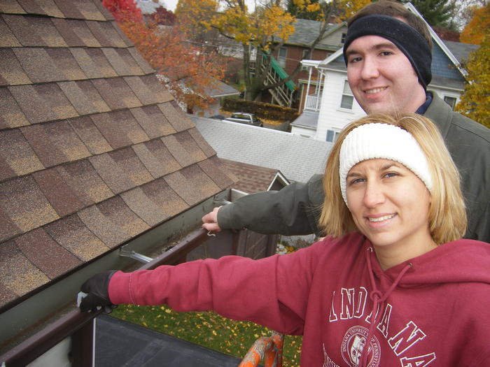Mike & Heather putting clips on the gutters.