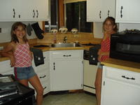 Ashlyn and Kayla showing off the kitchen