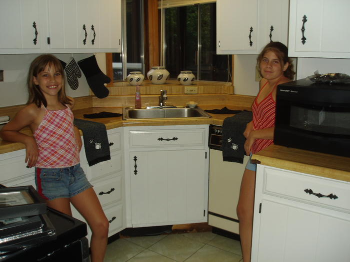 Ashlyn and Kayla showing off the kitchen