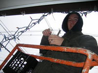 Mike hanging lights in the rain!