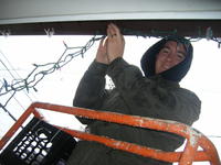 Mike hanging lights in the rain!