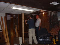 Mike and his dad remove some walls