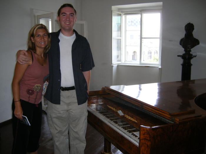Heather & Mike by a piano that Beethoven played