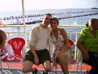 Mike & Heather with waverunners in the background.