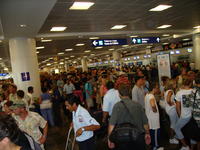 People trying to get flights out before Hurricane Emily arrives.