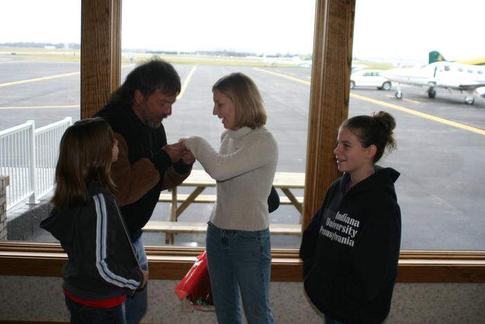 Heather's father checks out the ring with Heather's sisters