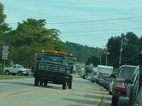 Tow trucks approach using the opposite lane